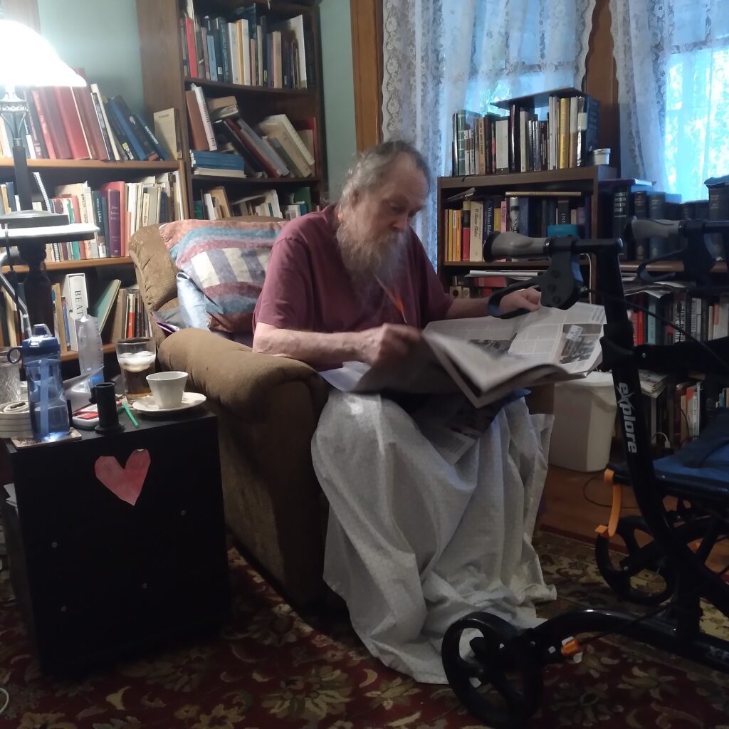 Steve reading in his recliner at home.